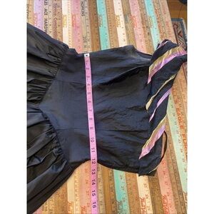 Elegant Black Women's Top with Pink and Gold Accents